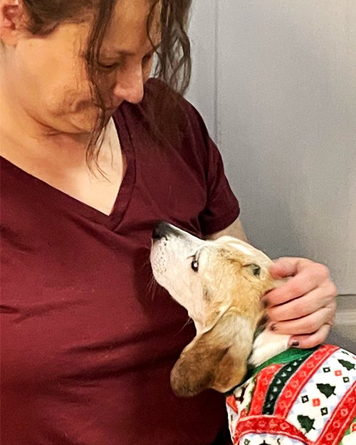 Photo of Christy (employee) and her dog, Cheerio