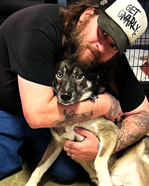 Photo of Nick (employee) and his dog, Ivan